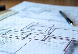 Architectural blueprints and a construction plan.